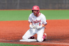 An IU Southeast baseball player celebrates on second base.